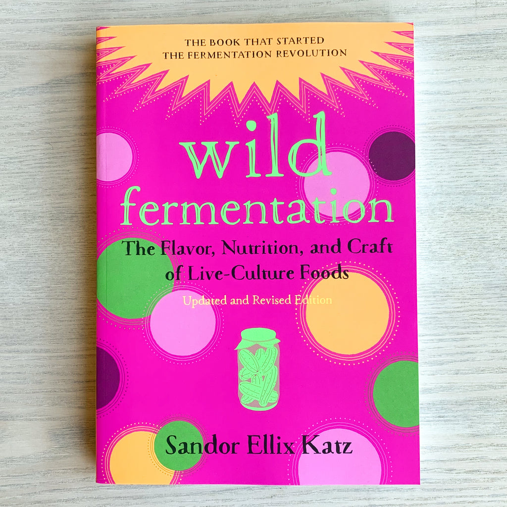 Front cover of Wild Fermentation with bold green text on a funky pink and gold and green background.