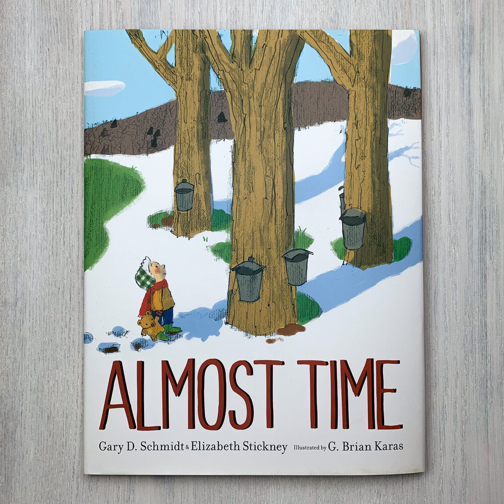 Hardcover picture book cover with illustration of pale-skinned child with a teddy bear looking up at tapped maple trees in a half-snowy landscape