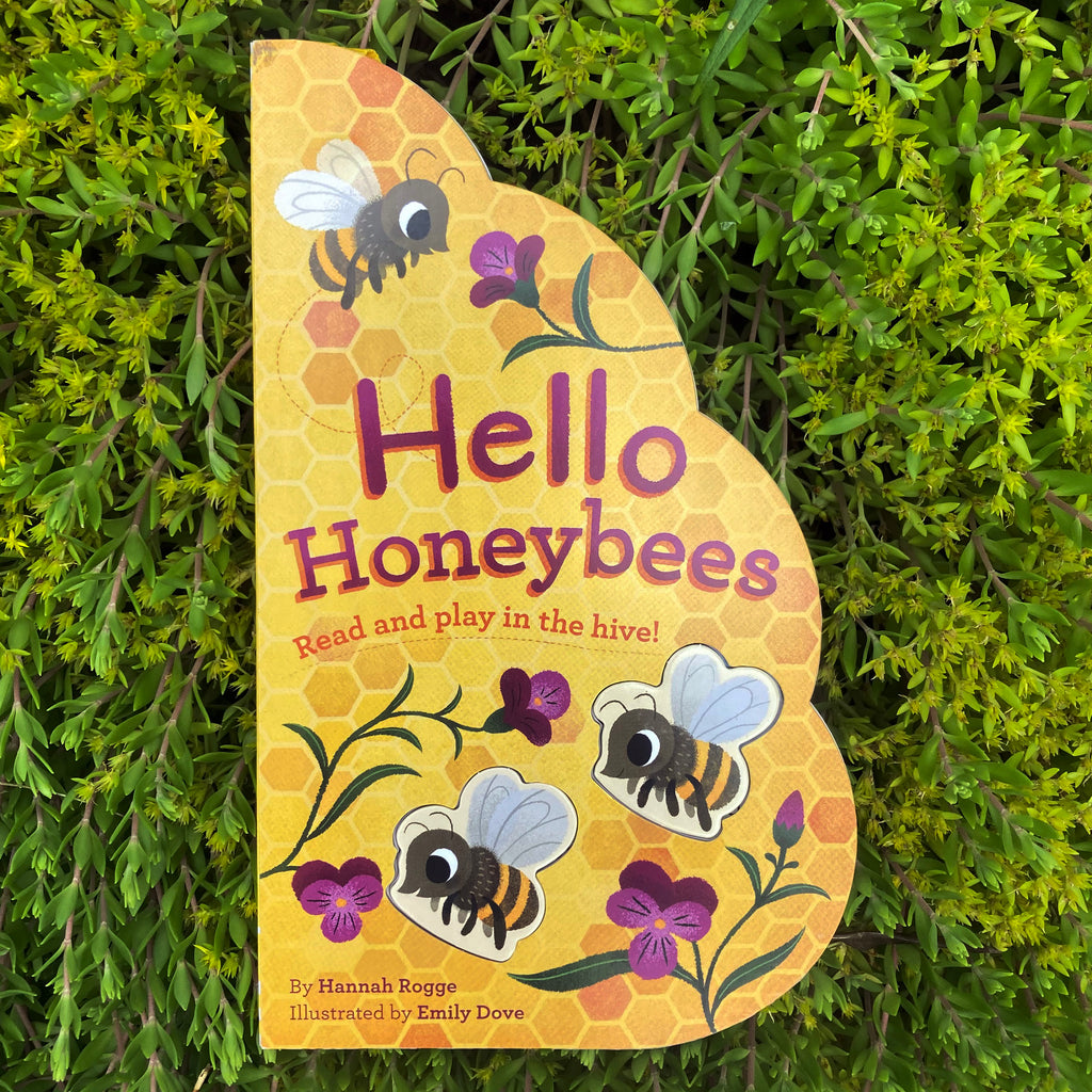 Hello Honeybees hive-shaped board book front cover featuring cute illustrations of large-eyed bees enjoying flowers near their hive,