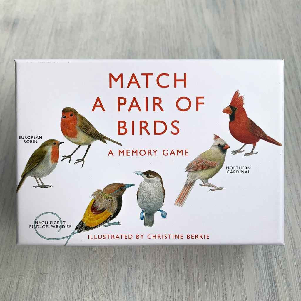 Front of Match A Pair of Birds game box displaying illustrations of Northern Cardinal, European Robin, and Magnificent Bird-of-Paradise, both male and female.