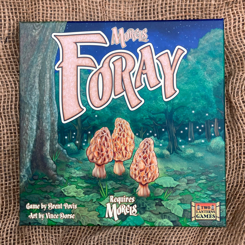 Front cover of Morels Foray game expansion box  featuring an illustration of morels growing in the woods surrounded by fireflies. Box notes that Morels game is required for use with this expansion.