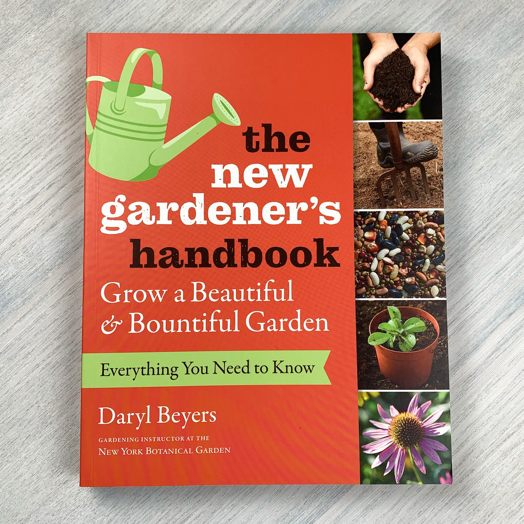 Soft green and red front cover of The New Gardener's Handbook with photos from a home garden.