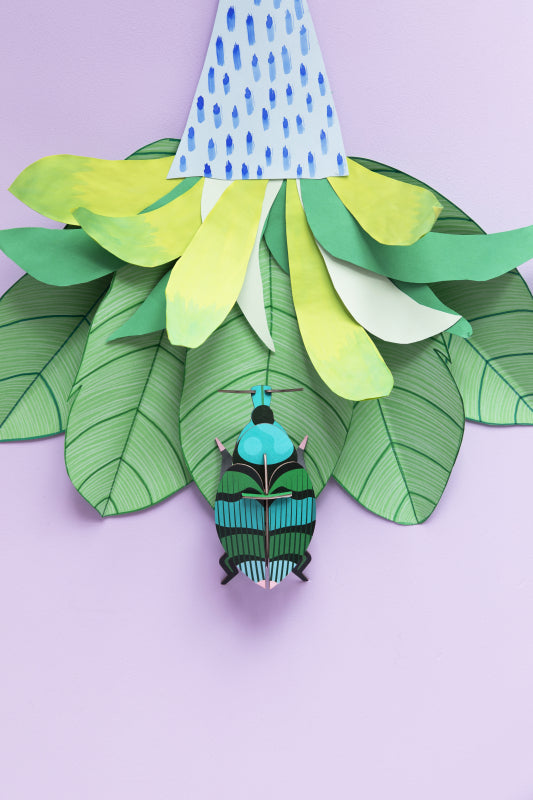 Weevil Beetle Wall Art featuring a three dimensional cardboard weevil on paper leaves.