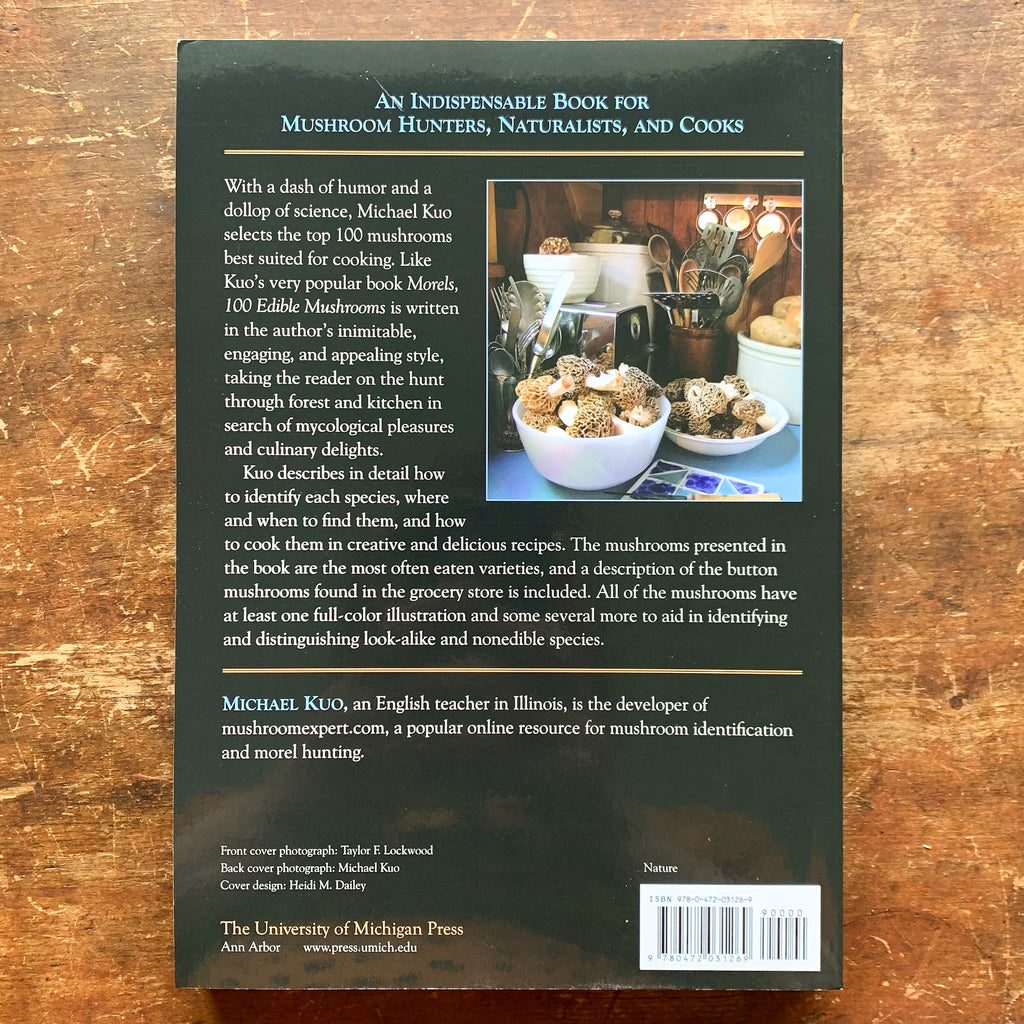 Back cover of guide with blurb and photo of heaping bowls of morel mushrooms in a kitchen
