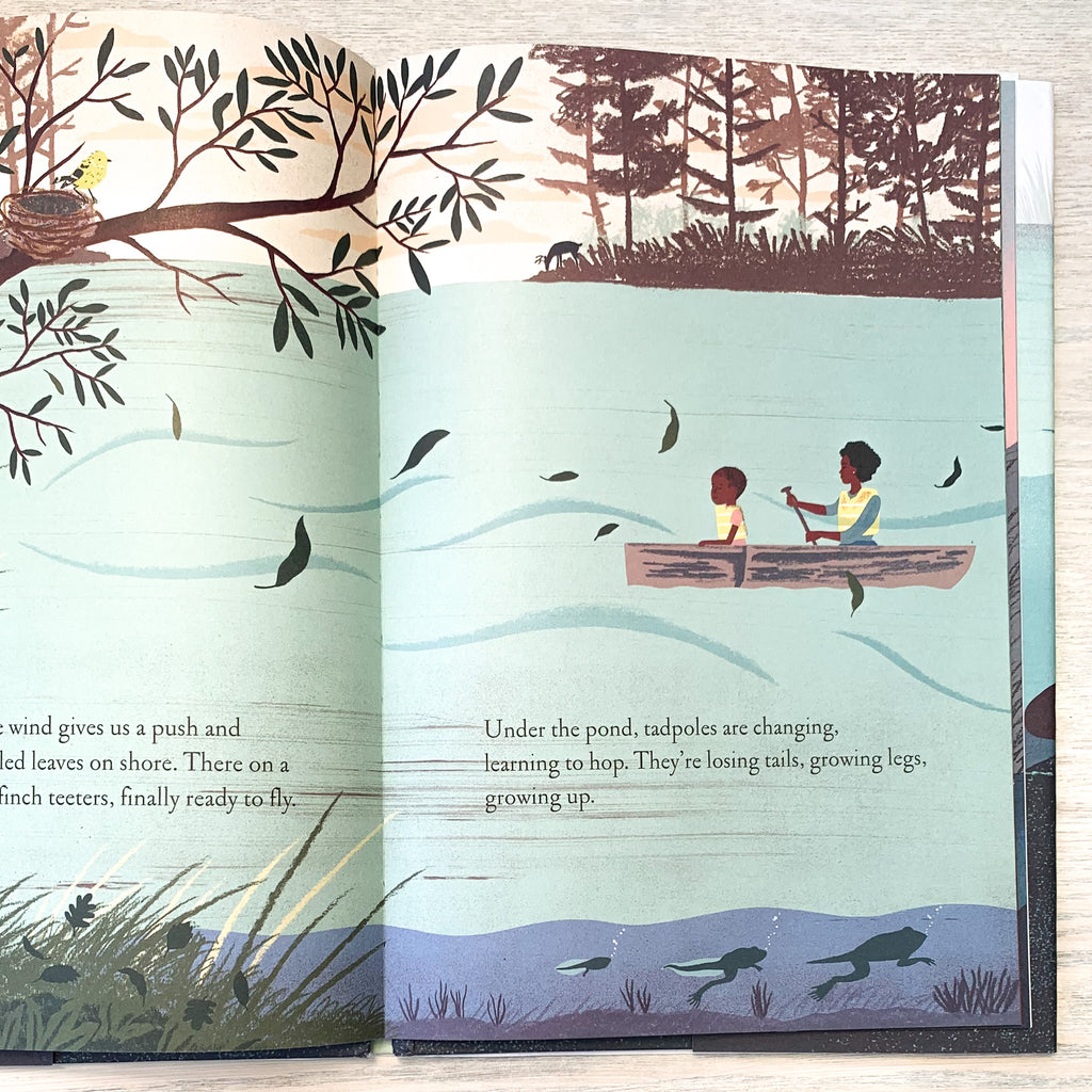 Inside page of Over And Under The Pond showing mother and child canoeing on a pond with a bird looking down from its nest from above, and a tadpole metamorphosing into a frog below the water.
