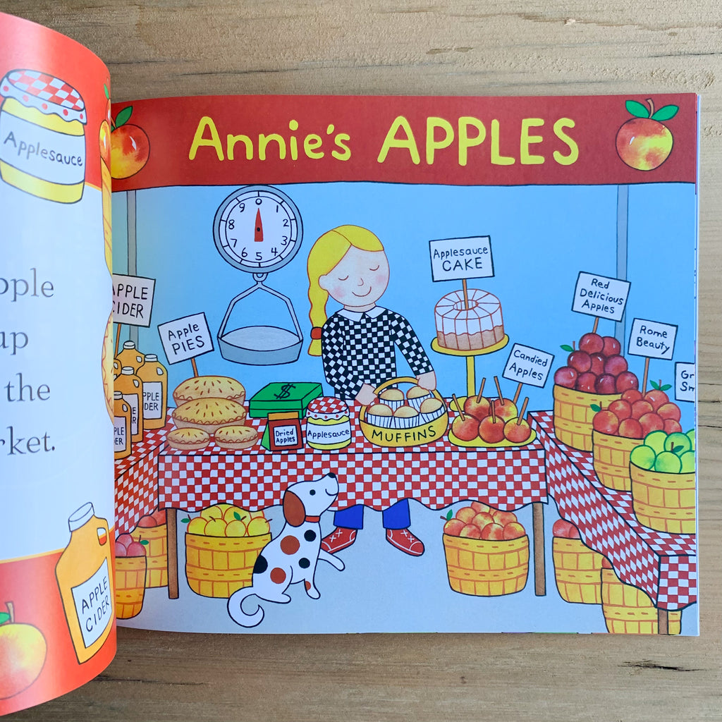 Picture book pages showing Annie at the farmer's market with apples, pies, cider, etc