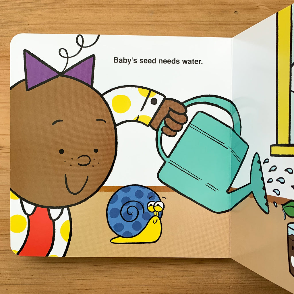 Board book interior pages of kid protagonist watering a plant while snail sidekick looks on and the text "Baby's seed needs water"