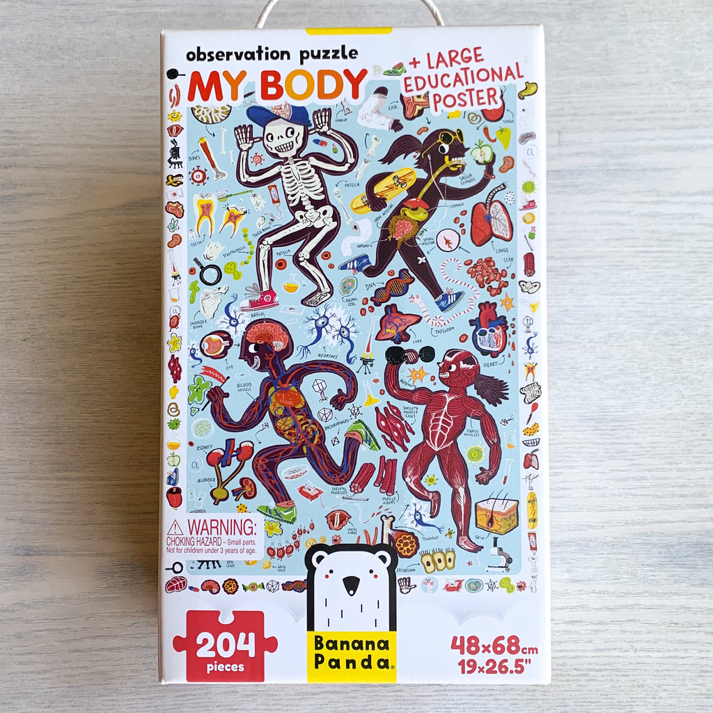 Front cover of My Body jigsaw puzzle showing stylized illustrations of four active kids and their skeletal, digestive, circulatory, and muscular systems, along with illustrations of other body parts like teeth, neurons, and DNA.
