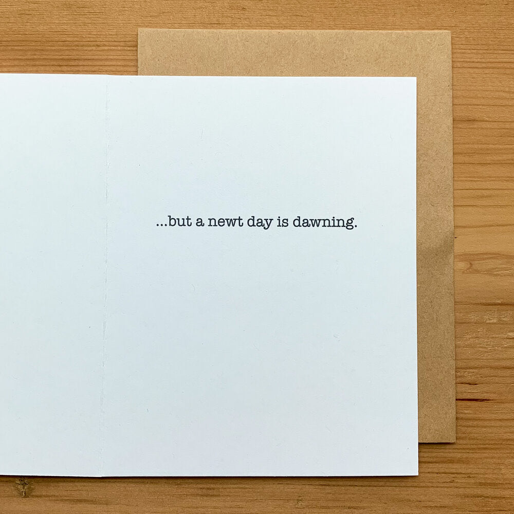 Interior of white greeting card with simple text, "...but a newt day is dawning."