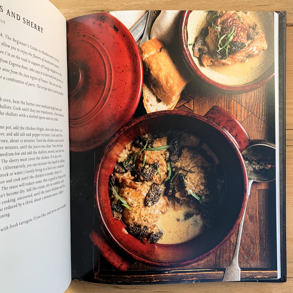 Full-page color photo of morel mushroom dish in a Le Cruset