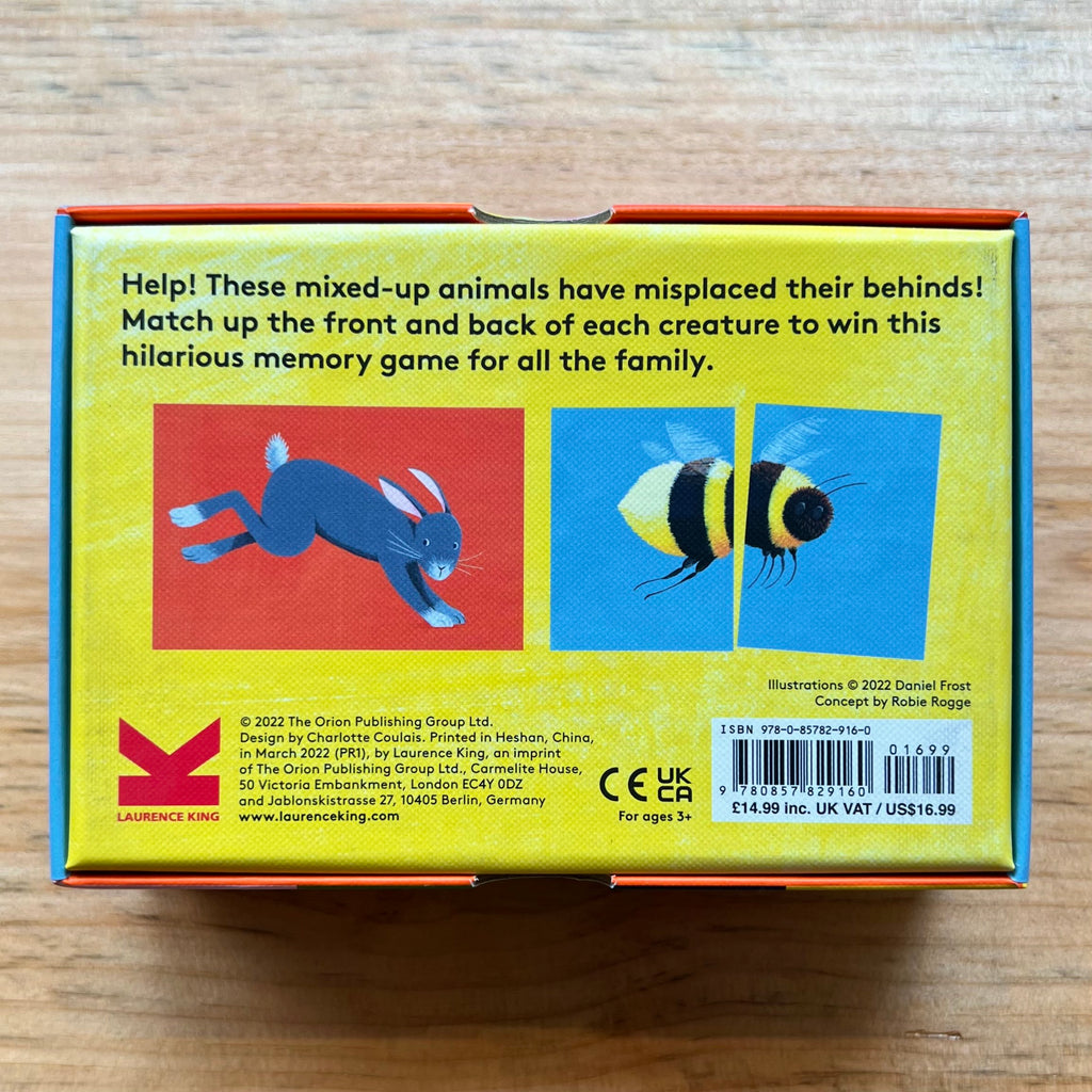Bright yellow back of the box with text and images of a rabbit and bee