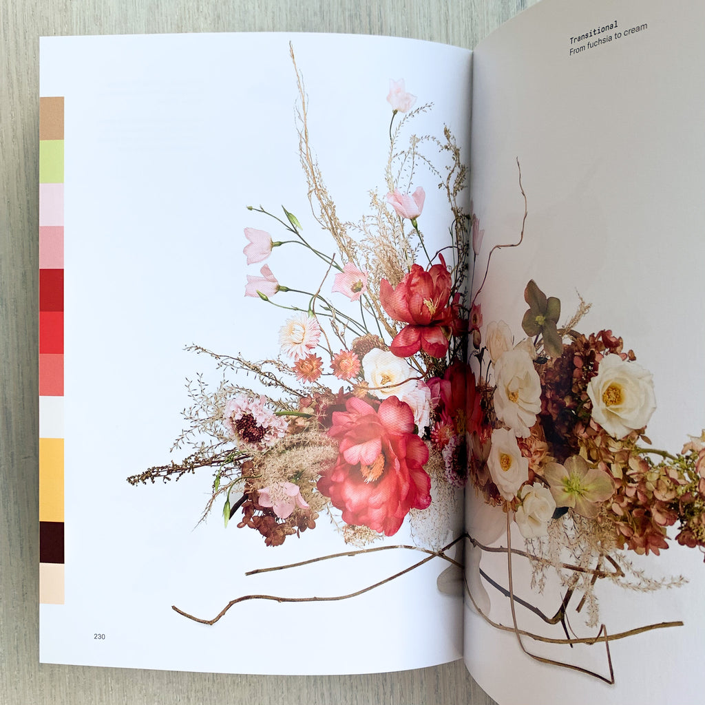 Interior book pages with floral arrangement and color palate laid out as a side border