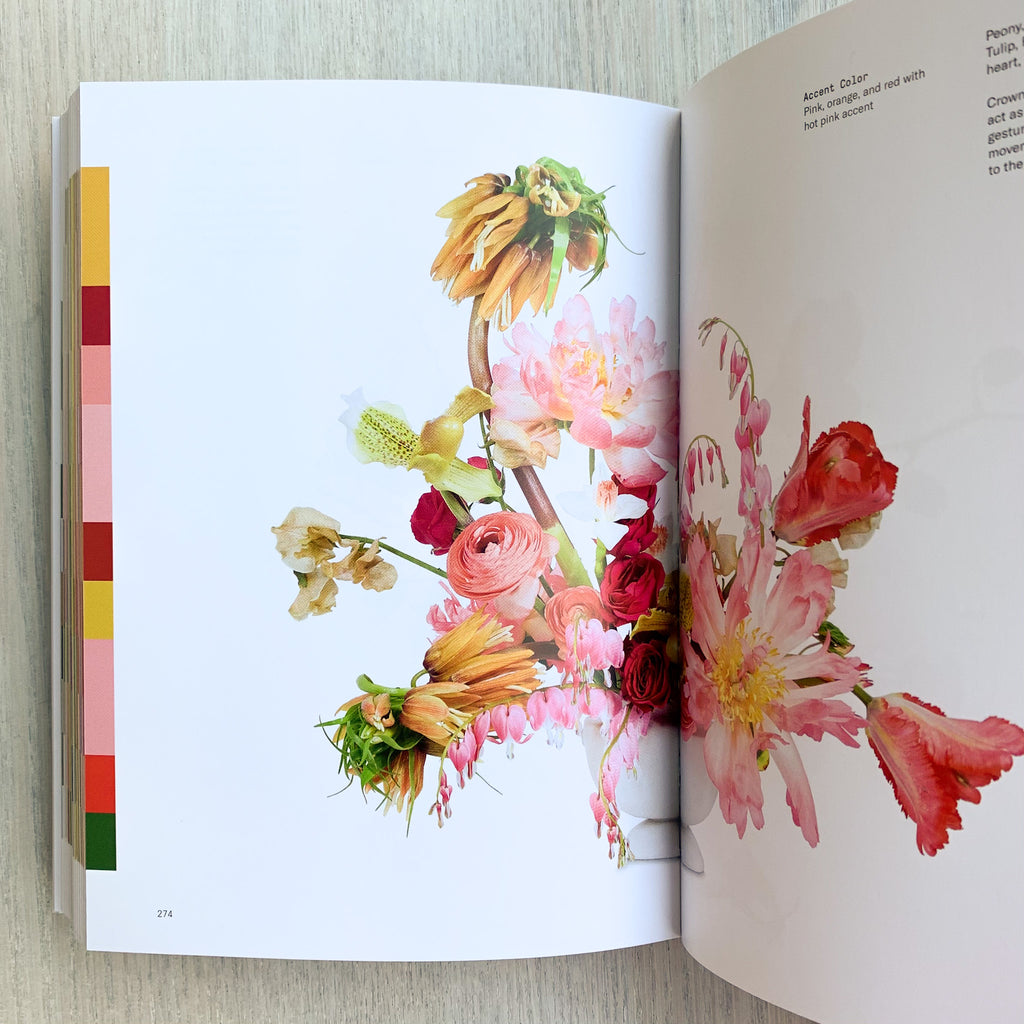 Interior book pages with floral arrangement and color palate laid out as a side border