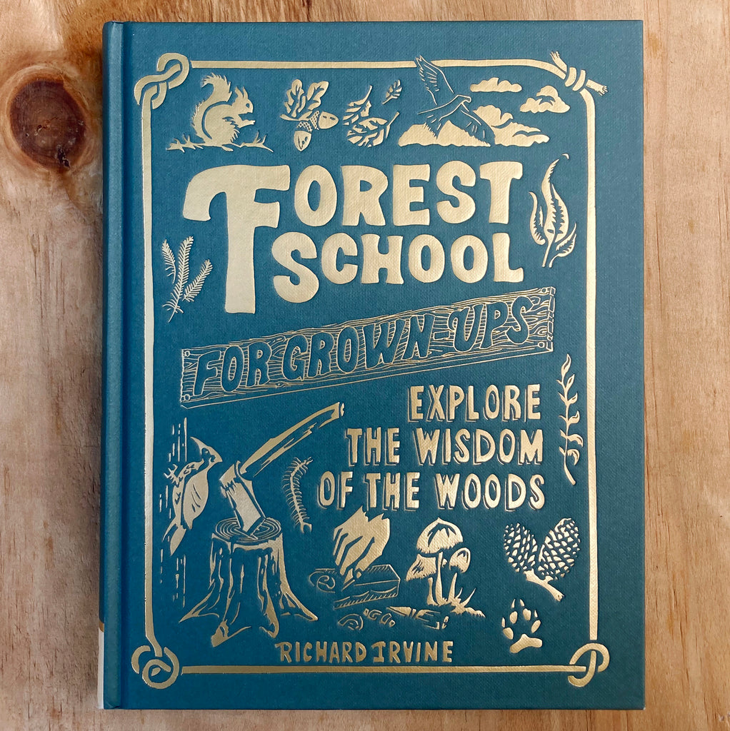 Forest School For Grown-Ups hard front cover featuring golden embossed text on a green background with illustrations of forest critters, ropework, an axe on a tree stump, and other nature imagery.
