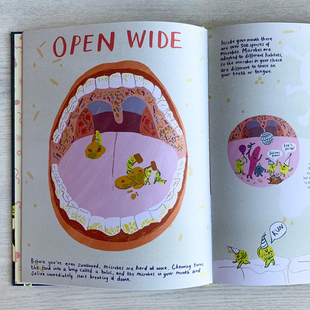 Interior picture book spread with page title "OPEN WIDE" and image of a wide open mouth and little anthropomorphized microbes running around