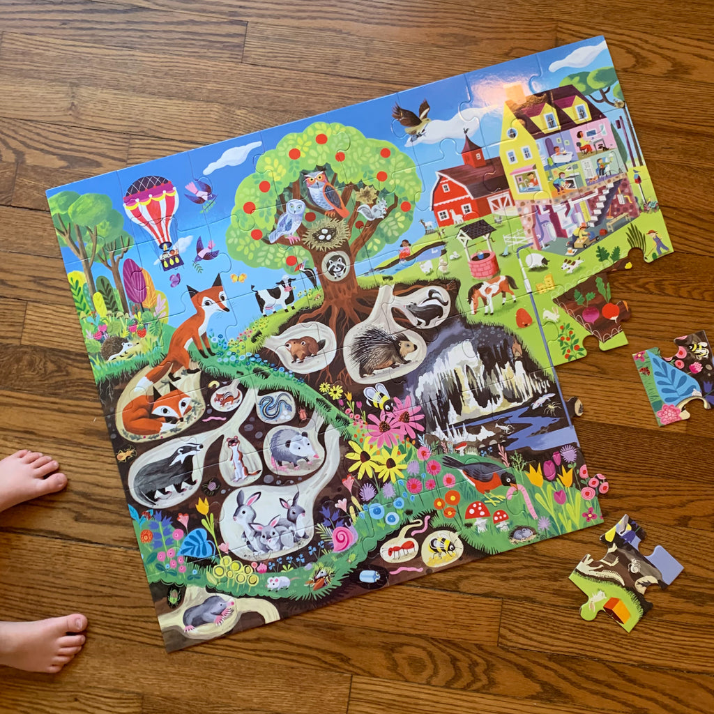 Within the Country Puzzle shown on the floor partly assembled with its oversized pieces.