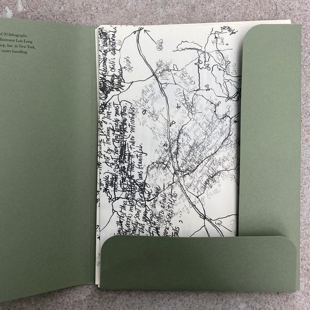 Inside photograph of the MUSHROOM BOOK folder showing many loose pages with writing and sketches sprawled across them.
