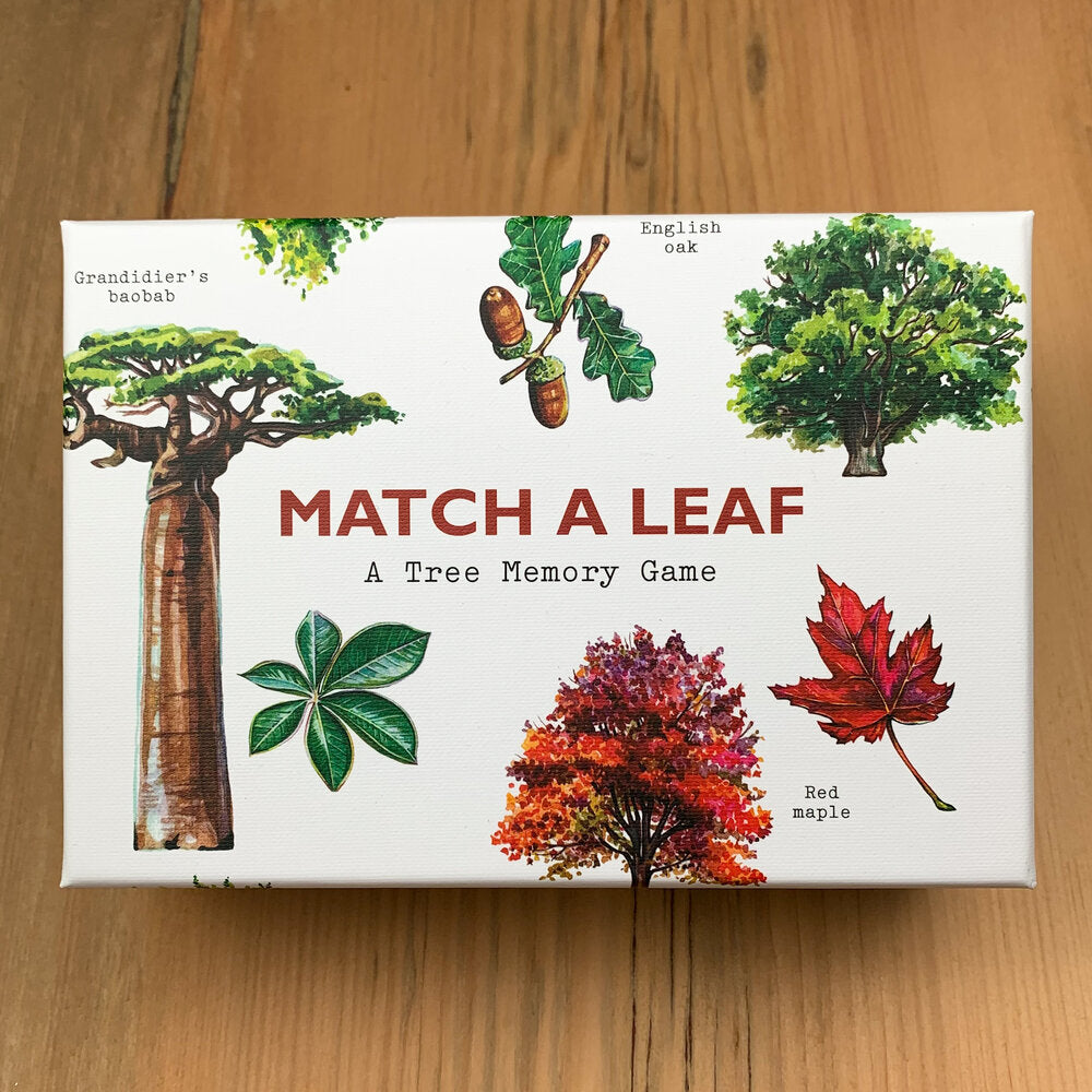 Cover of Match A Leaf game box displaying illustrations of the English oak, red maple, Grandidier's baobab, and their leaves.