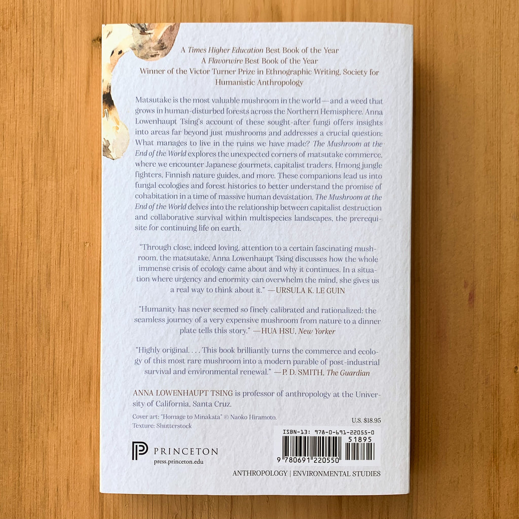 Back cover of The Mushroom at the End of the World with a description of the book and reviews.