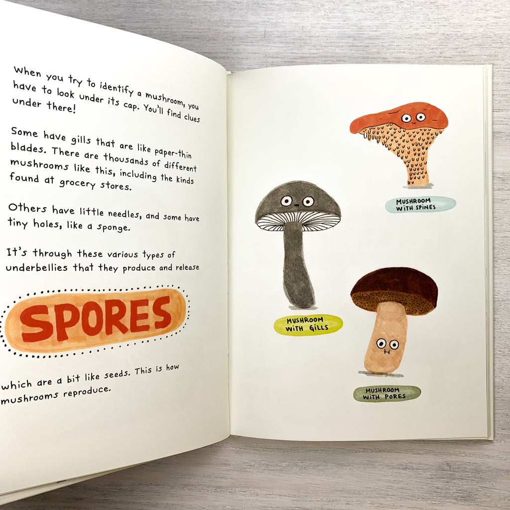 Book pages with text and cartoony mushroom illustrations with eyes