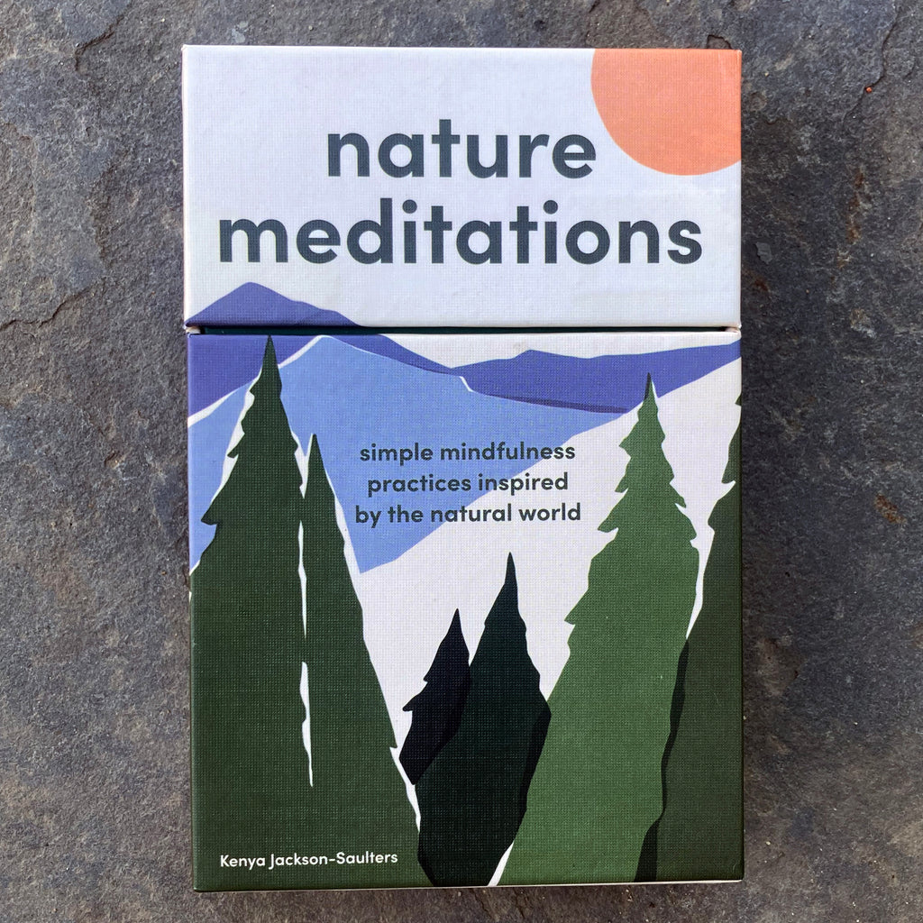 Nature Meditations card deck box front showing a simple illustration of a forest and mountains with the sun above.