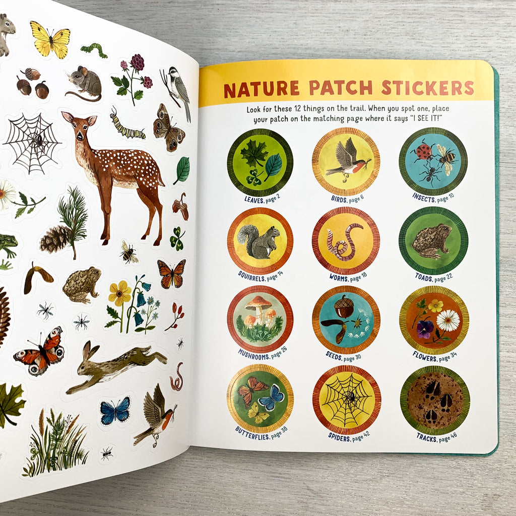 Inside page of On The Nature Trail featuring colorful nature stickers and achievement badge stickers.