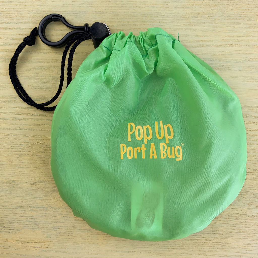 Pop Up Port A Bug container in its green carry bag with included black lanyard.