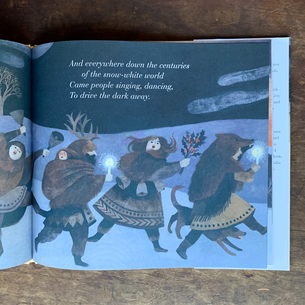 Inside page of The Shortest day with a stylized illustration of people in traditional dress dancing, making music, and walking through the snowy darkness.