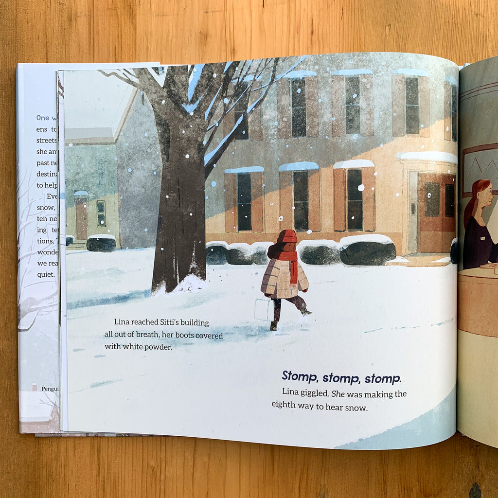Inside page of Ten Ways To Hear Snow with an illustration of a girl stomping through the snow in her front yard.