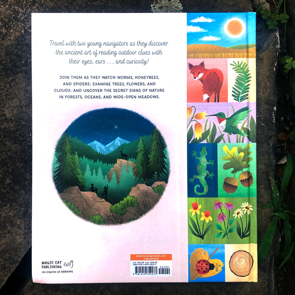 The Secret Signs of Nature hard back cover featuring illustrations of nature imagery including a fox, a fern, a gecko, flowers, and acorns.
