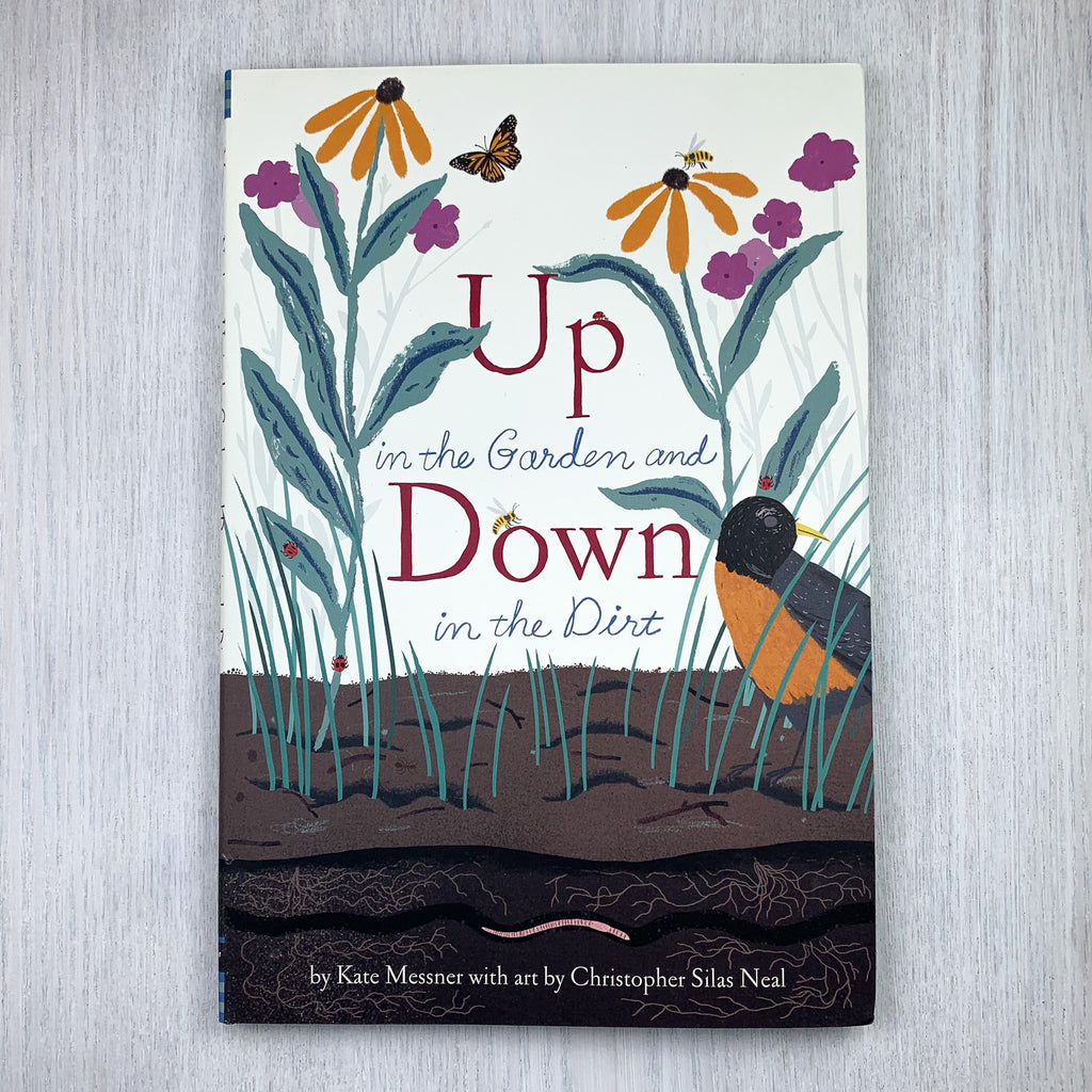 Front hard cover of Up in the Garden, Down in the Dirt showing an illustration of a butterfly and bee flying about flowers, a robin on the ground , and a worm squirming beneath the dirt.