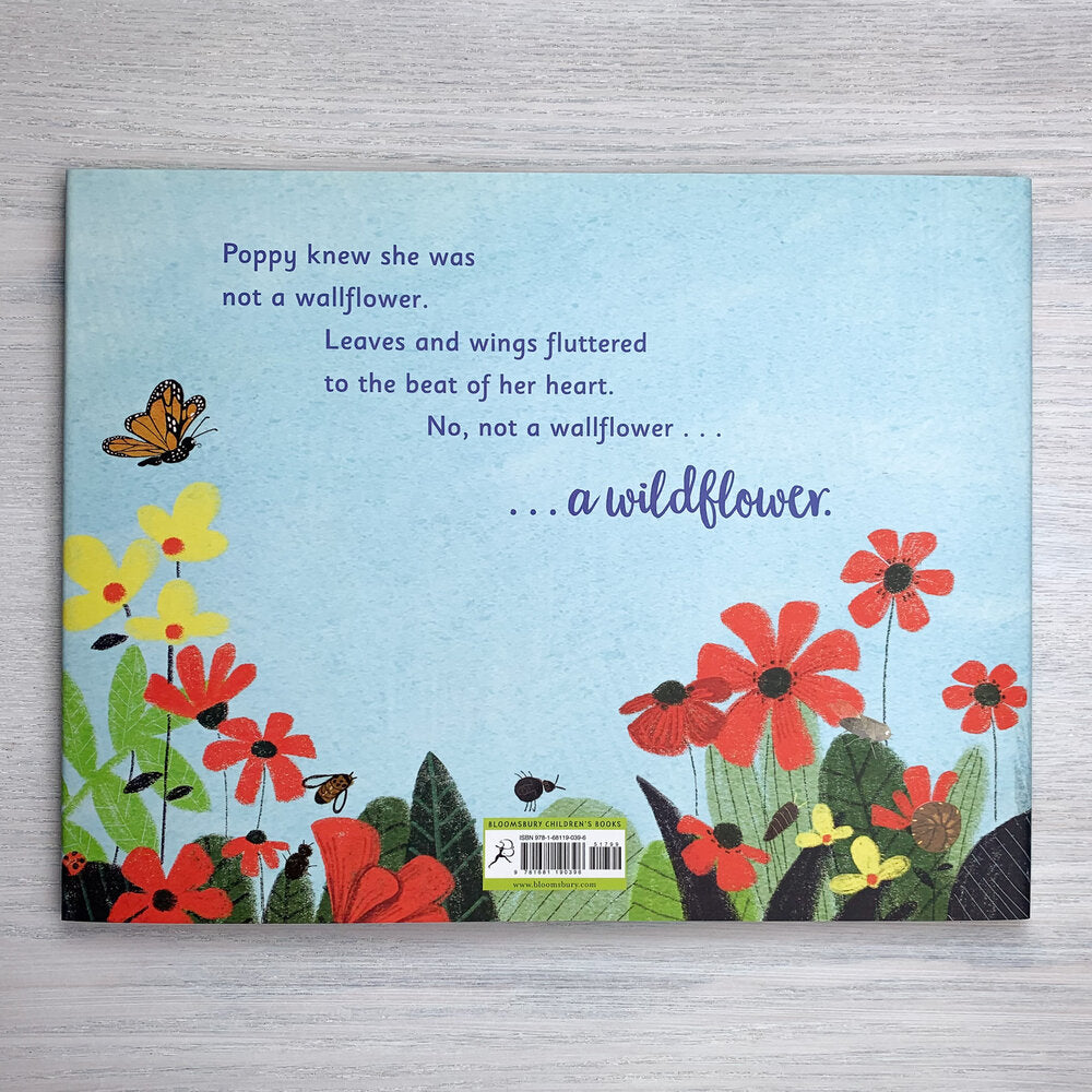 Back cover with blue sky and red and yellow flowers, plus a few different bugs