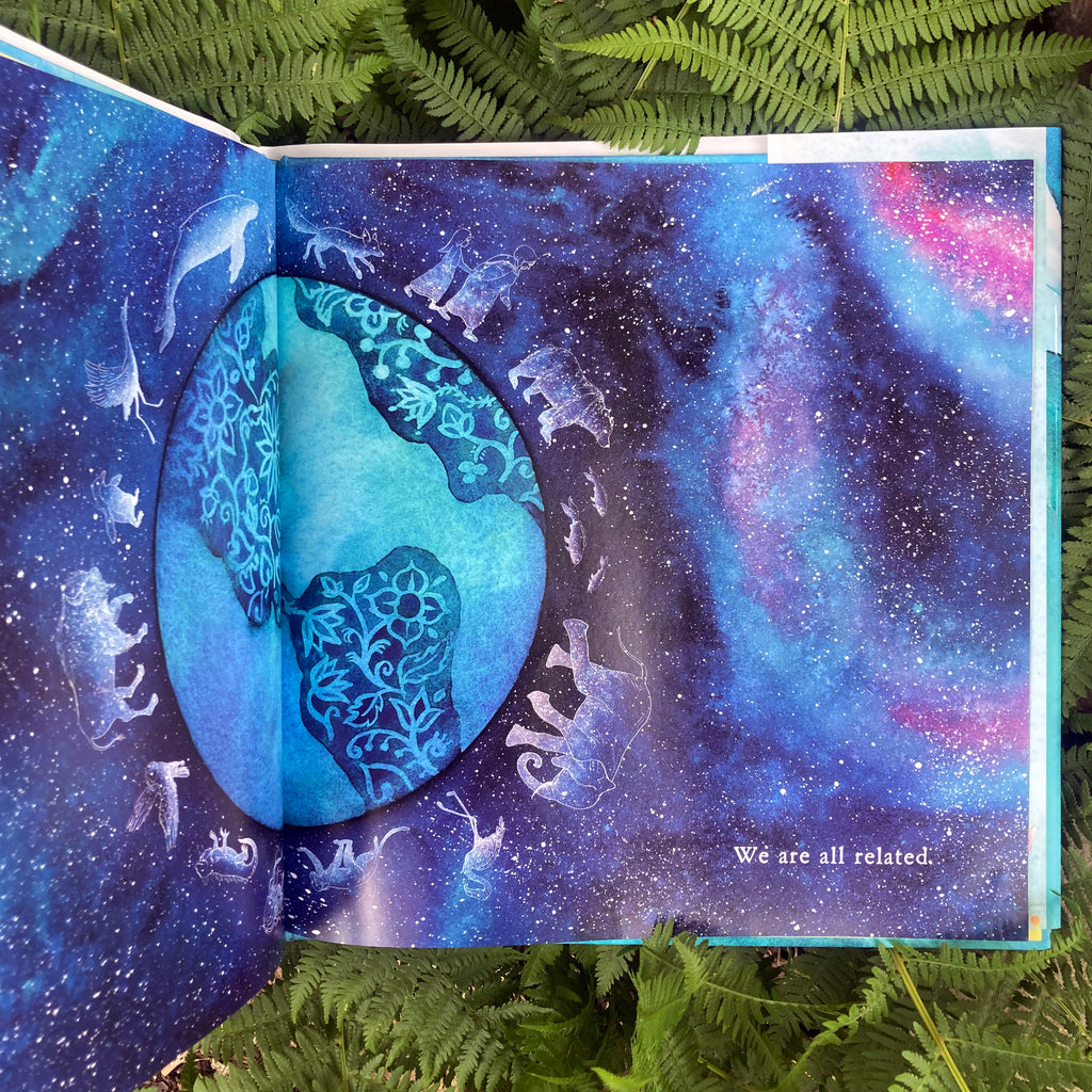 Inside page of We Are The Water Protectors picture book showing an illustration of a stylized earth floating through the cosmos with the words "We are all related."